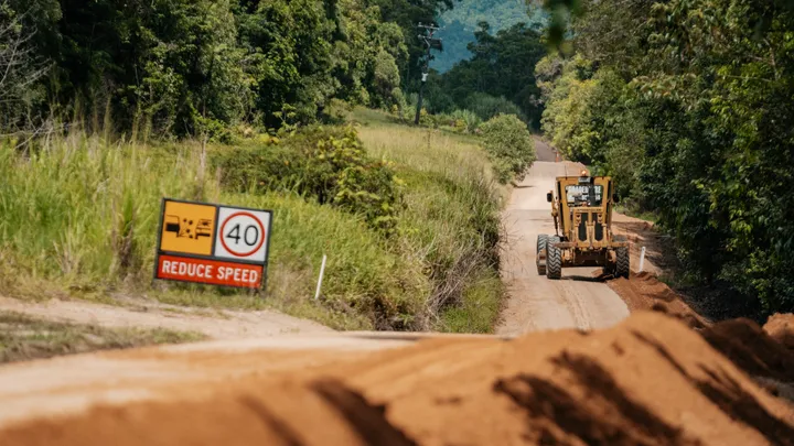 Grader working on a rural road stabilisation project as part of civil construction efforts to improve road durability, safety, and accessibility in regional areas.